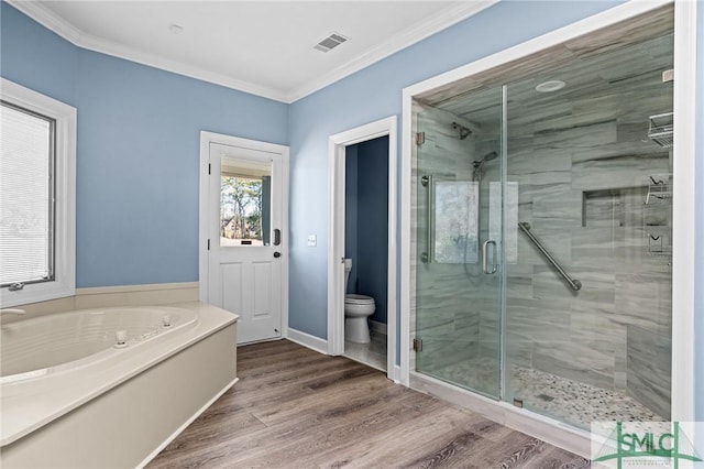 full bathroom with toilet, wood finished floors, visible vents, a shower stall, and crown molding