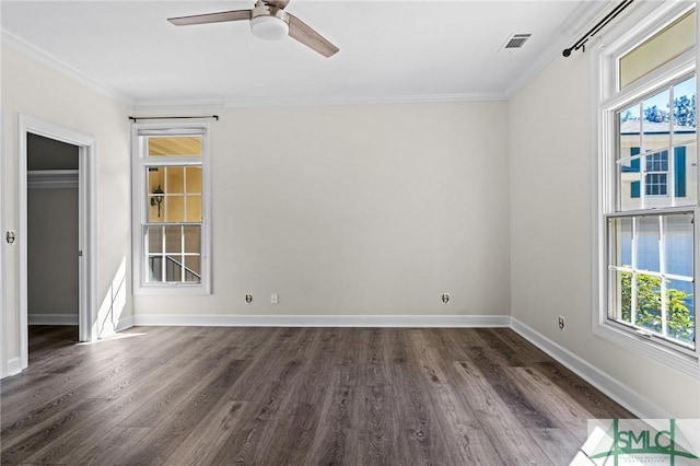 unfurnished bedroom with visible vents, baseboards, dark wood finished floors, a ceiling fan, and ornamental molding