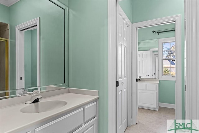 full bath featuring vanity and tile patterned floors