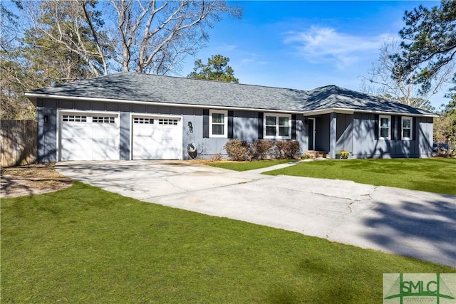 ranch-style home featuring a garage, concrete driveway, board and batten siding, and a front lawn