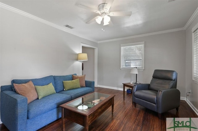 living room featuring dark wood-style flooring, visible vents, ornamental molding, a ceiling fan, and baseboards