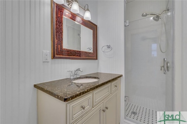 bathroom featuring a stall shower and vanity