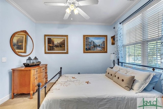 bedroom with light carpet, ceiling fan, baseboards, and crown molding