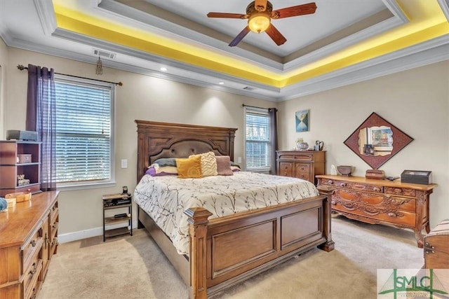 bedroom featuring a tray ceiling, crown molding, light colored carpet, visible vents, and baseboards