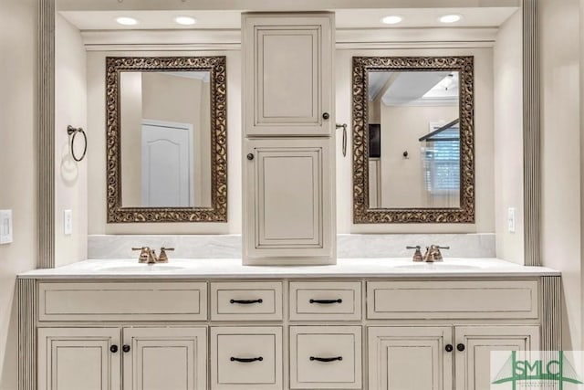 full bath with double vanity and a sink