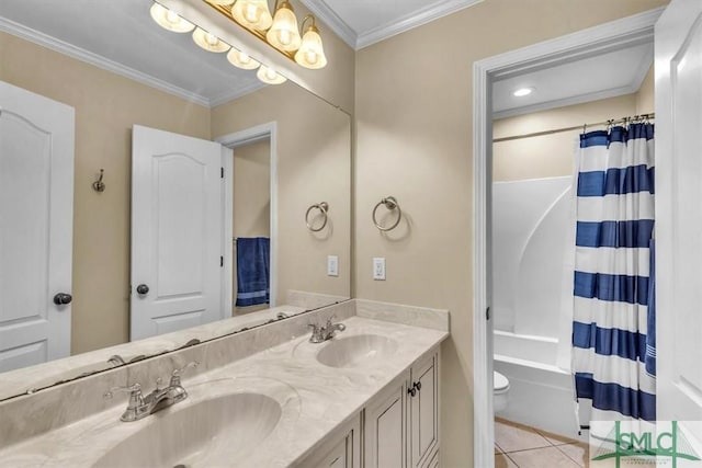 full bathroom with double vanity, ornamental molding, a sink, and tile patterned floors