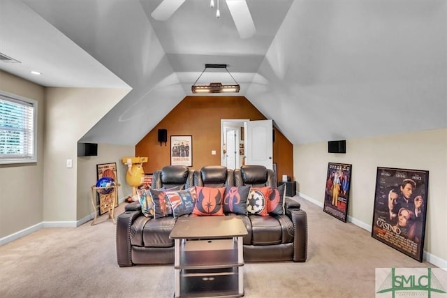 cinema featuring vaulted ceiling, carpet floors, and baseboards