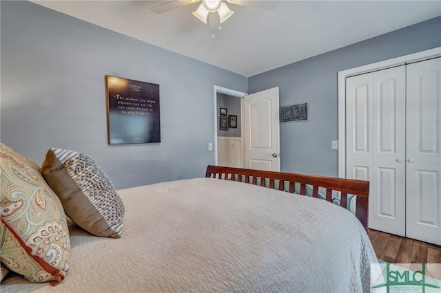 bedroom featuring ceiling fan, a closet, and wood finished floors