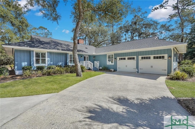 ranch-style house with an attached garage, driveway, roof with shingles, a front lawn, and a chimney