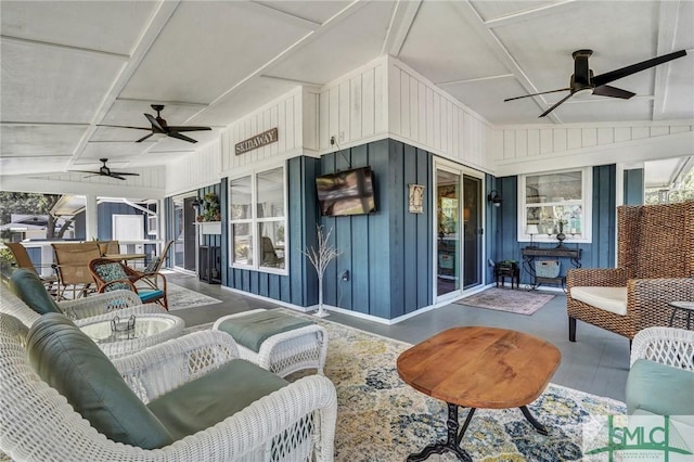 sunroom with a ceiling fan