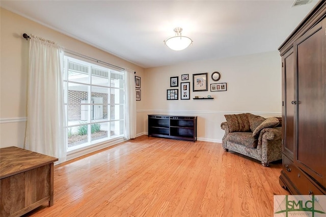 sitting room featuring light wood-style floors and baseboards