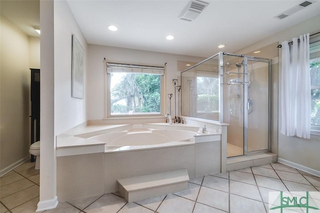 full bathroom with tile patterned flooring, visible vents, a shower stall, and a bath