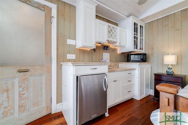 kitchen with glass insert cabinets, black microwave, light countertops, and dark wood-style flooring