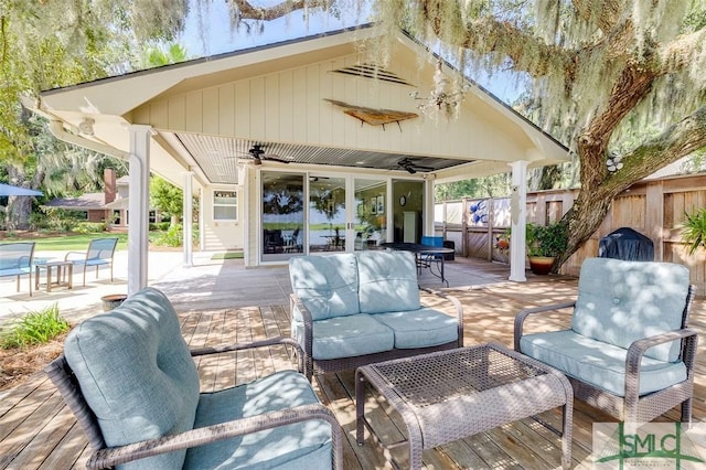 view of patio / terrace featuring a ceiling fan, fence, and an outdoor hangout area