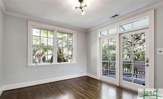 entryway with baseboards, dark wood-type flooring, visible vents, and crown molding