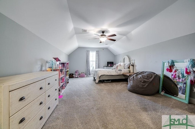 carpeted bedroom featuring visible vents, vaulted ceiling, and ceiling fan