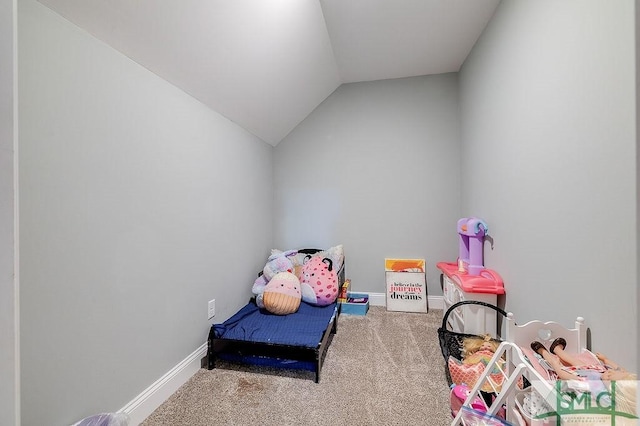 rec room with vaulted ceiling, carpet, and baseboards