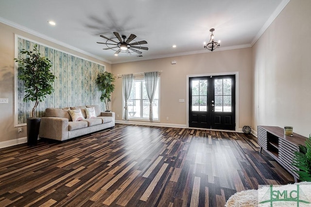 foyer entrance with baseboards, ornamental molding, an inviting chandelier, french doors, and recessed lighting