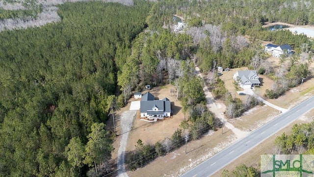 aerial view with a wooded view