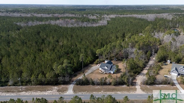 drone / aerial view with a view of trees