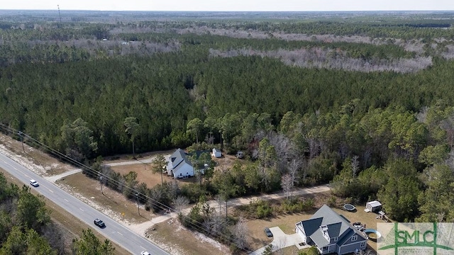 bird's eye view with a view of trees