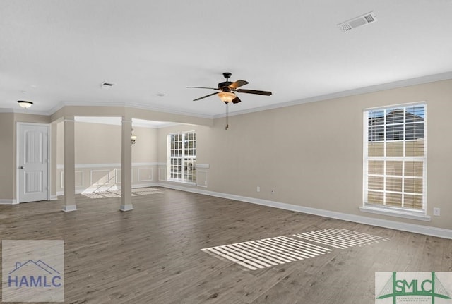 unfurnished living room featuring crown molding, visible vents, ceiling fan, and wood finished floors