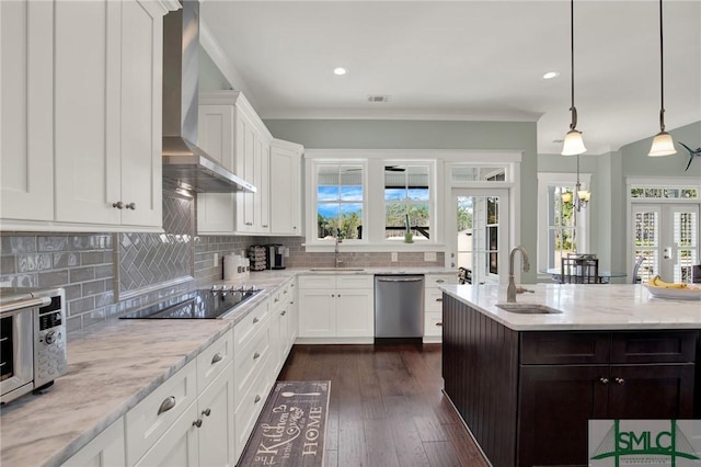 kitchen featuring dishwasher, wall chimney exhaust hood, black electric stovetop, and a sink