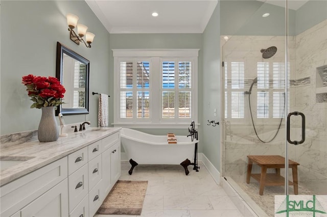 bathroom with a sink, a freestanding bath, marble finish floor, a shower stall, and double vanity