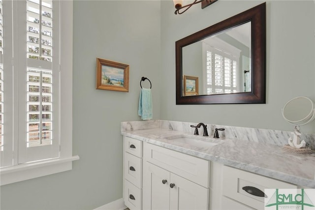 bathroom with a wealth of natural light and vanity