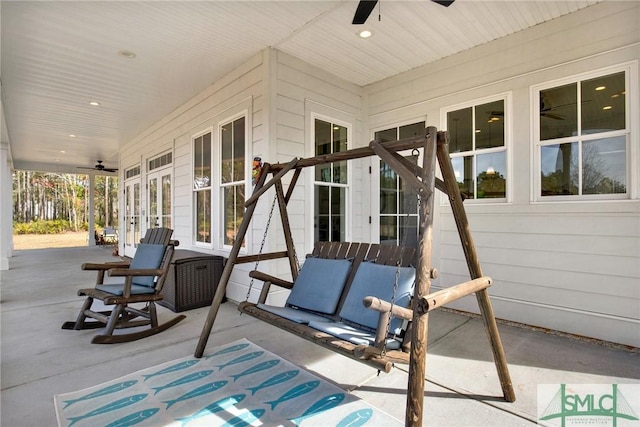 view of patio featuring ceiling fan