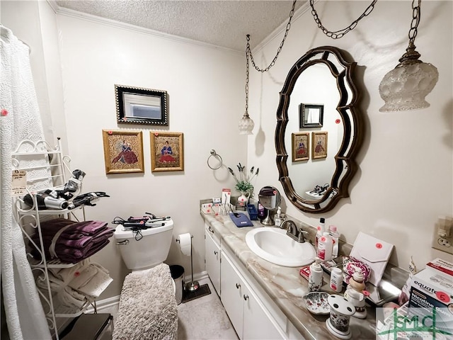 half bath featuring toilet, ornamental molding, a textured ceiling, and vanity
