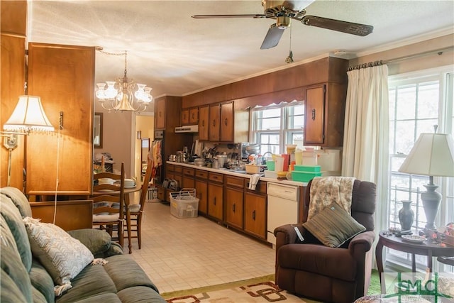 kitchen featuring brown cabinets, crown molding, light countertops, white dishwasher, and ceiling fan with notable chandelier