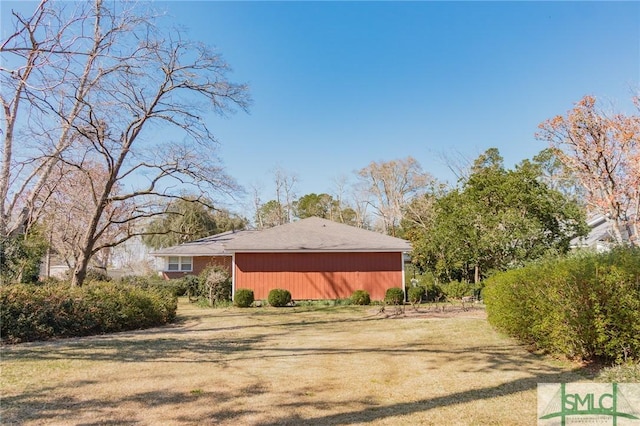 view of home's exterior with a yard