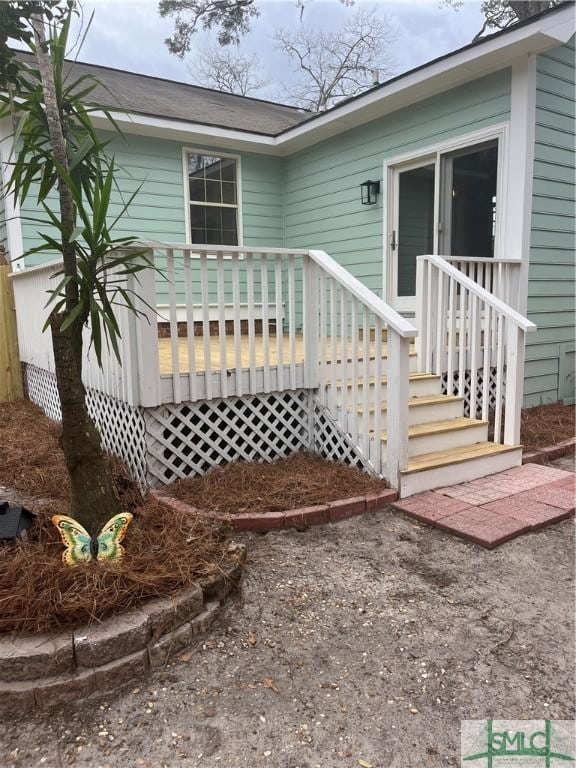 exterior space featuring a wooden deck