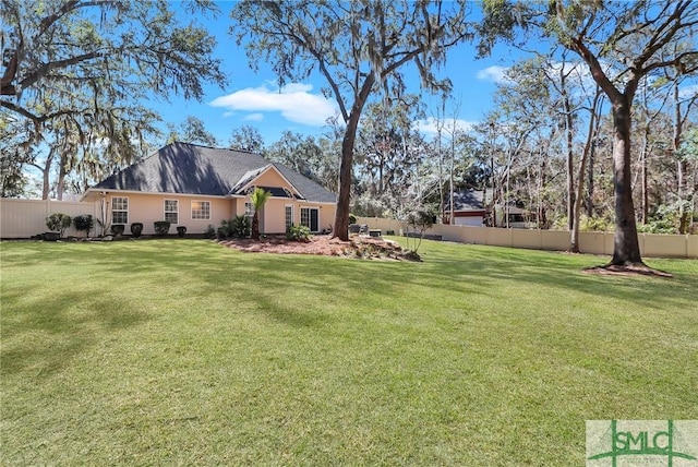 view of yard featuring fence