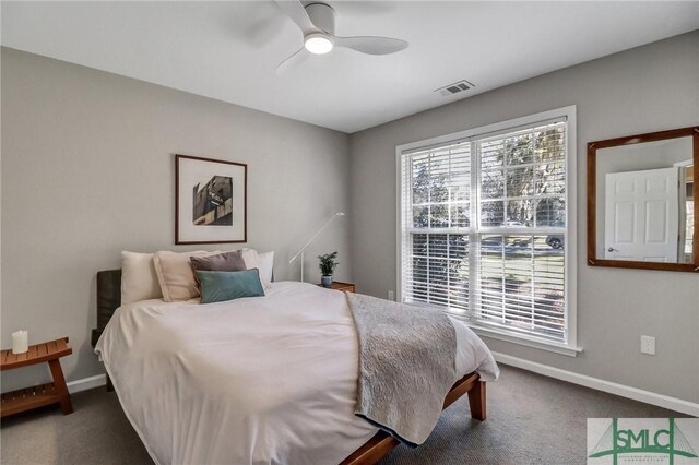 bedroom featuring carpet floors, visible vents, baseboards, and a ceiling fan