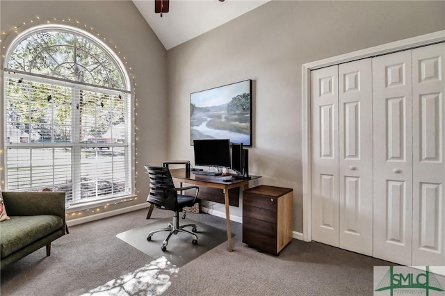 home office with vaulted ceiling, ceiling fan, carpet flooring, and baseboards