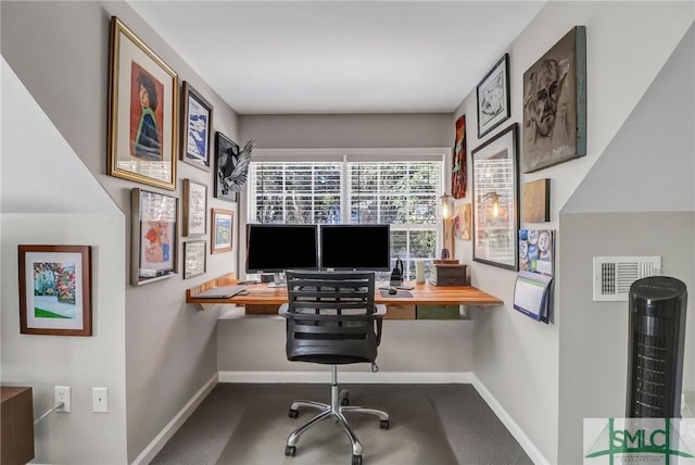 home office with visible vents and baseboards