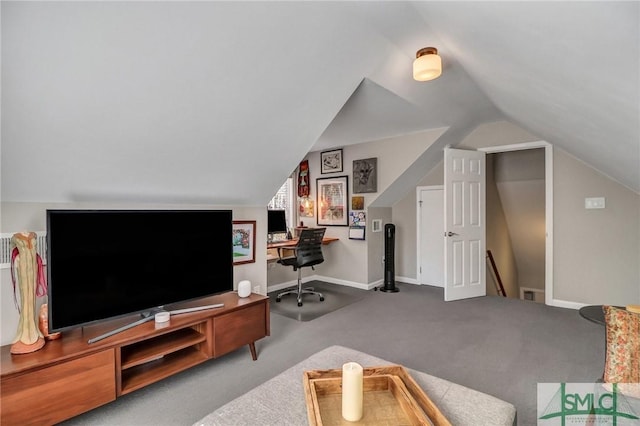 interior space featuring baseboards, vaulted ceiling, and carpet flooring