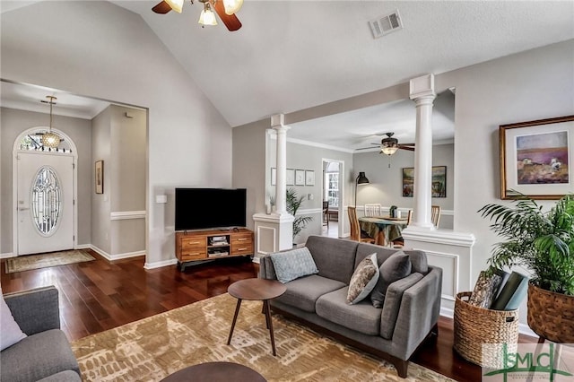 living room featuring a ceiling fan, decorative columns, visible vents, and wood finished floors