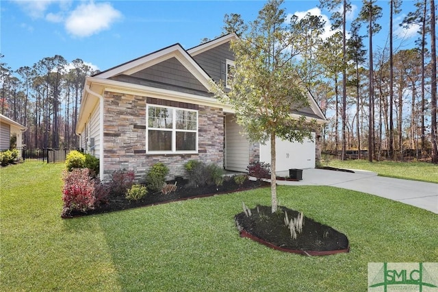 view of front facade featuring stone siding, driveway, a front lawn, and fence