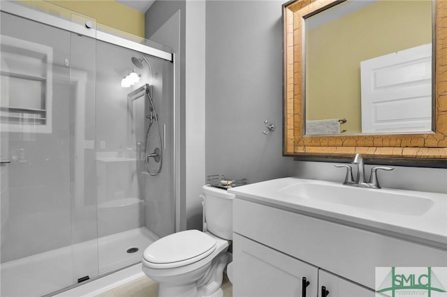 full bathroom with a shower stall, toilet, and vanity