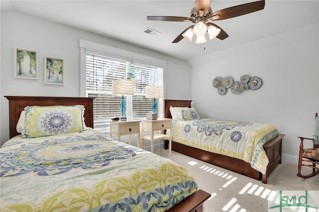 bedroom with carpet floors, ceiling fan, visible vents, and vaulted ceiling