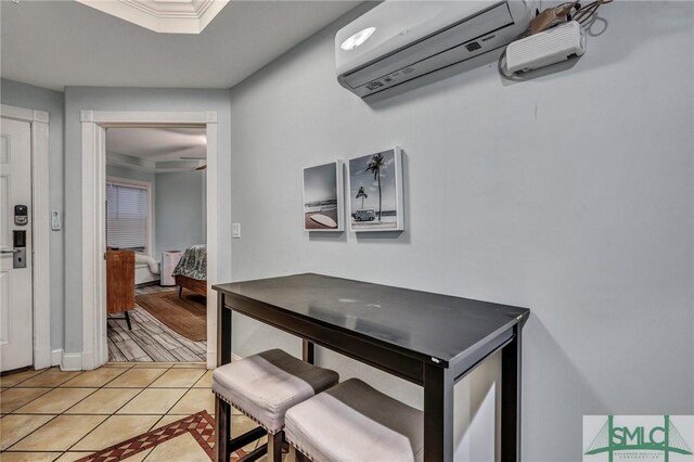 dining room with light tile patterned floors and a wall mounted AC