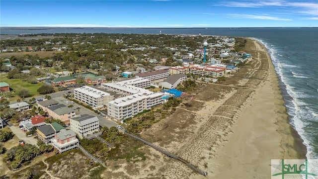 birds eye view of property featuring a view of the beach and a water view