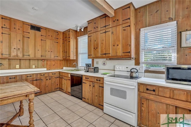 kitchen featuring black dishwasher, light tile patterned floors, light countertops, stainless steel microwave, and electric range