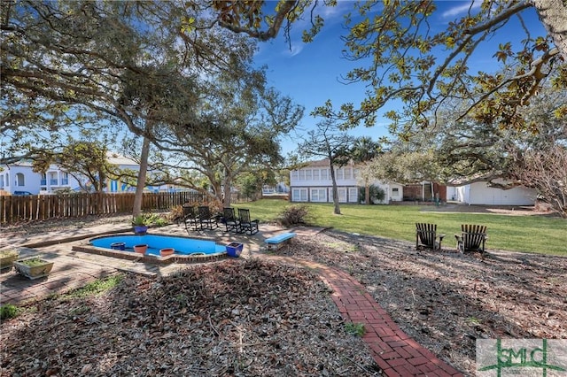 view of yard with fence and a patio