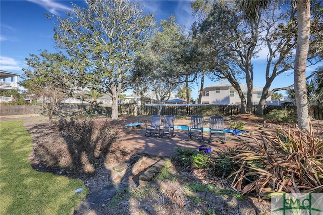 view of yard featuring a patio area and fence