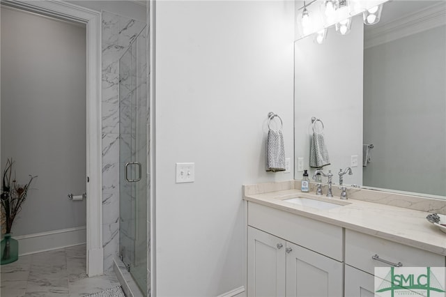 full bath featuring a marble finish shower, baseboards, marble finish floor, crown molding, and vanity