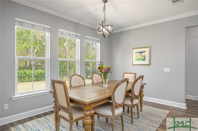 dining area featuring dark wood-style floors, baseboards, and ornamental molding